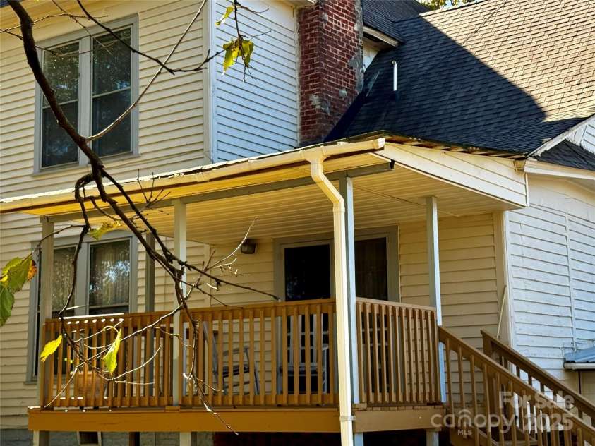4689 Lakeview Acres Road, Valdese, NC 28690.  MLS# CAR4260635, YatesRealty ID 8599. The covered back deck is right off the kitchen with double screen doors.