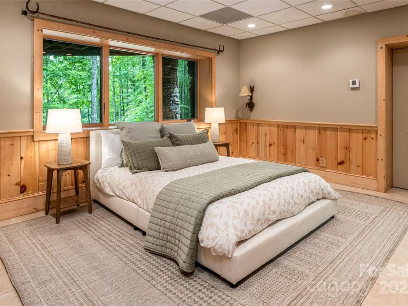 303 Flying Hawk Trail, Waynesville, NC 28786.  MLS# CAR4272138, YatesRealty ID 86. 3rd bedroom (ensuite)- not pictured is HUGE 937 sft storage room in basement