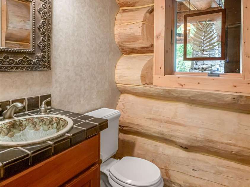 303 Flying Hawk Trail, Waynesville, NC 28786.  MLS# CAR4272138, YatesRealty ID 86. Powder room on main