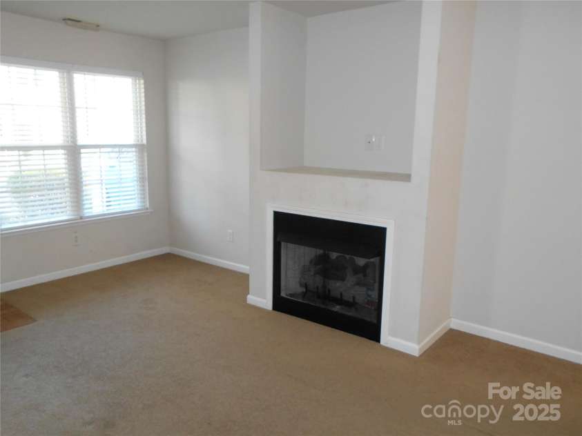 112 Alpine Ridge Drive, Asheville, NC 28803.  MLS# CAR4243877, YatesRealty ID 8601. Fireplace in living room