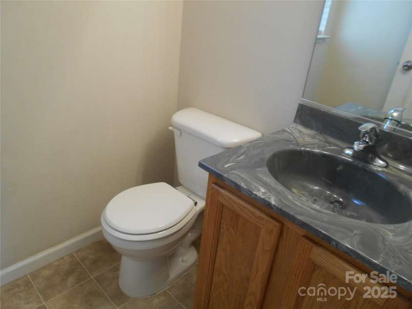 112 Alpine Ridge Drive, Asheville, NC 28803.  MLS# CAR4243877, YatesRealty ID 8601. Half Bath Downstairs