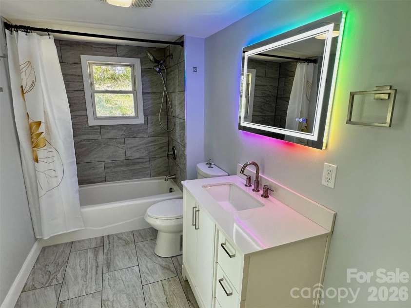 11 Martel Lane, Asheville, NC 28804.  MLS# CAR4304470, YatesRealty ID 8611. Fun mirror in Primary Bath!