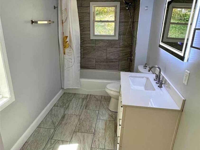 11 Martel Lane, Asheville, NC 28804.  MLS# CAR4304470, YatesRealty ID 8611. Fun mirror in Primary Bath!