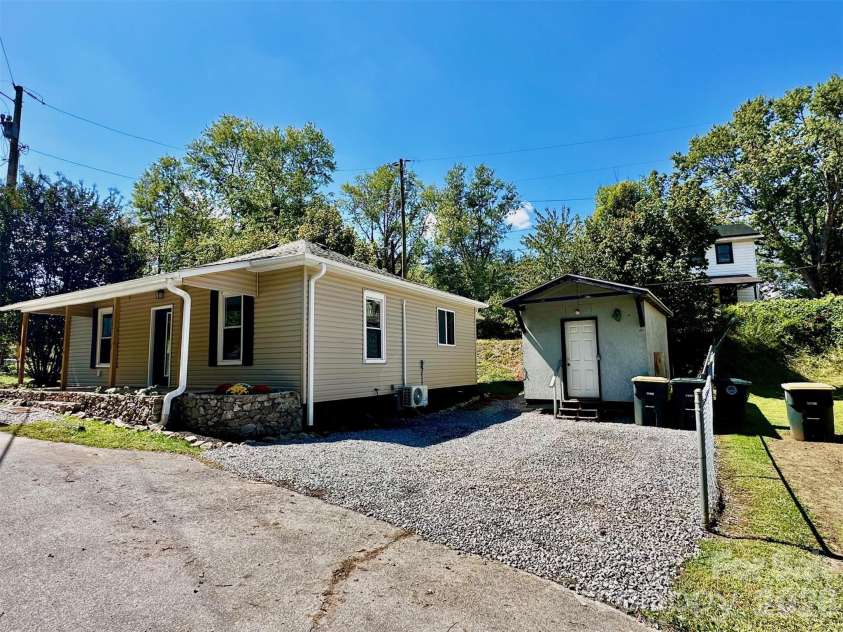 11 Martel Lane, Asheville, NC 28804.  MLS# CAR4304470, YatesRealty ID 8611. Gravel parking & shed
