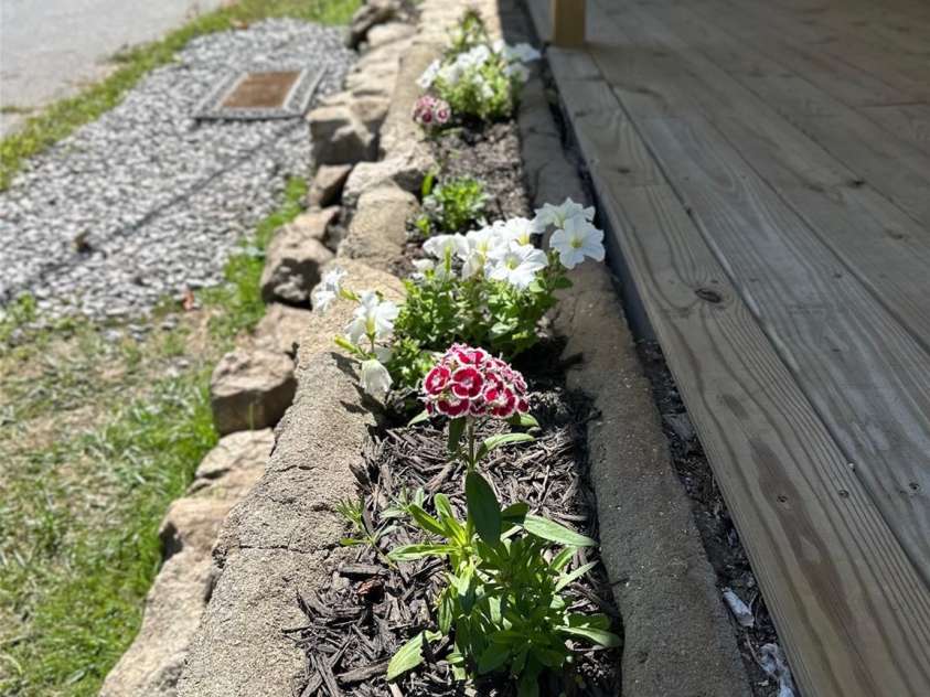 11 Martel Lane, Asheville, NC 28804.  MLS# CAR4304470, YatesRealty ID 8611. Planters along Covered Front Porch