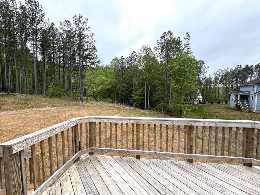 157 Powder Spring Drive, Statesville, NC 28677.  MLS# CAR4222061, YatesRealty ID 8611. Back Porch to Backyard