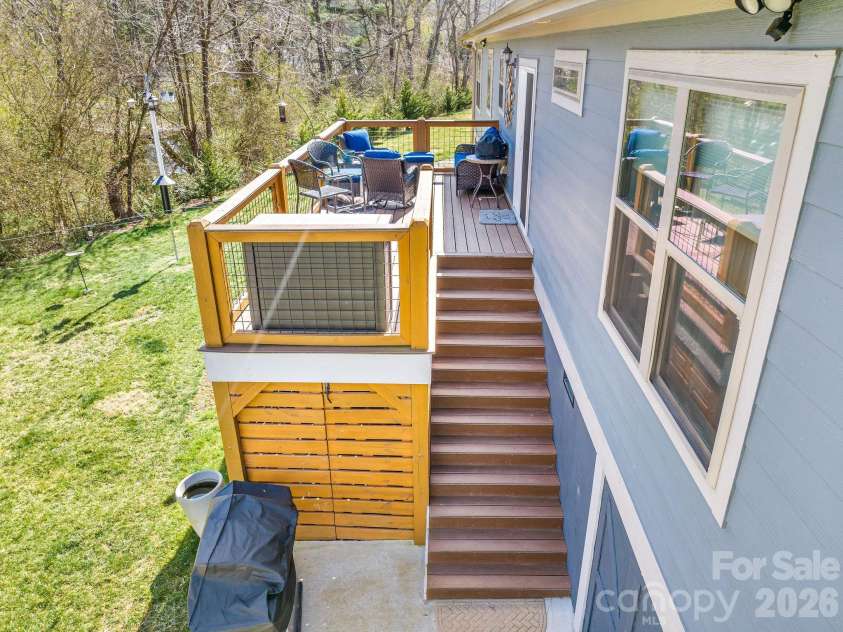 223 Reilly Drive, Leicester, NC 28748.  MLS# CAR4353690, YatesRealty ID 8619. Deck access to backyard space.