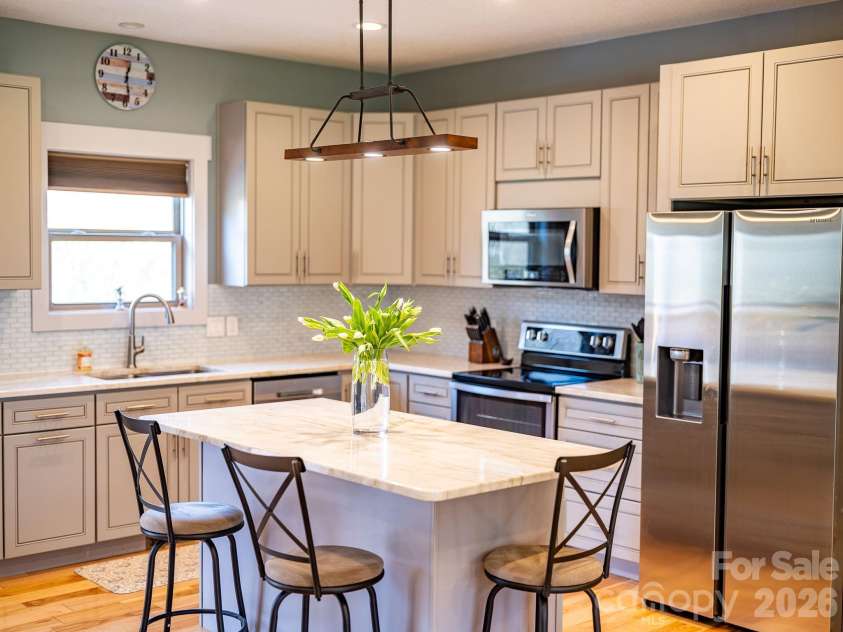223 Reilly Drive, Leicester, NC 28748.  MLS# CAR4353690, YatesRealty ID 8619. Kitchen - bright & airy.