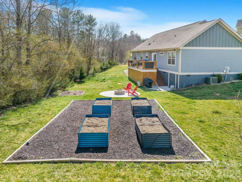 223 Reilly Drive, Leicester, NC 28748.  MLS# CAR4353690, YatesRealty ID 8619. Raised beds will soon be planted for spring!