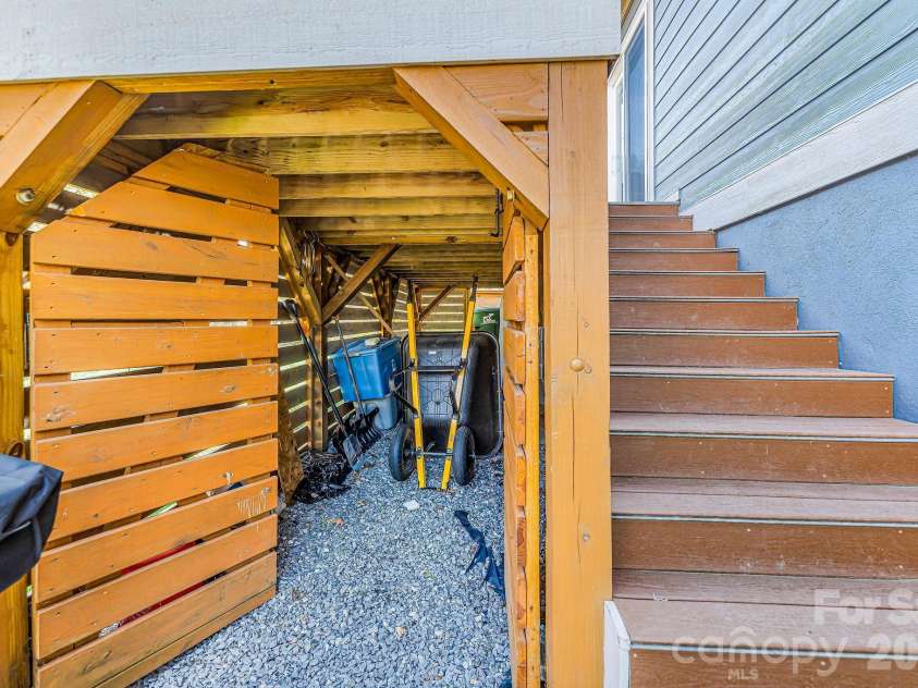 223 Reilly Drive, Leicester, NC 28748.  MLS# CAR4353690, YatesRealty ID 8619. Under the deck storage too!