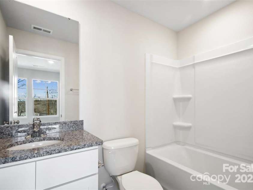 225 Kennerly Avenue, Mooresville, NC 28115.  MLS# CAR4222778, YatesRealty ID 8620. Secondary Bedroom Bathroom
