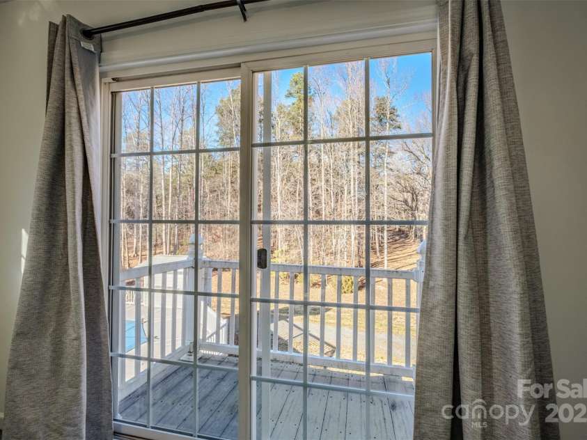 1215 Juniper Street, Salisbury, NC 28146.  MLS# CAR4329687, YatesRealty ID 8623. Balcony Overlooking Pool in Primary Bedroom