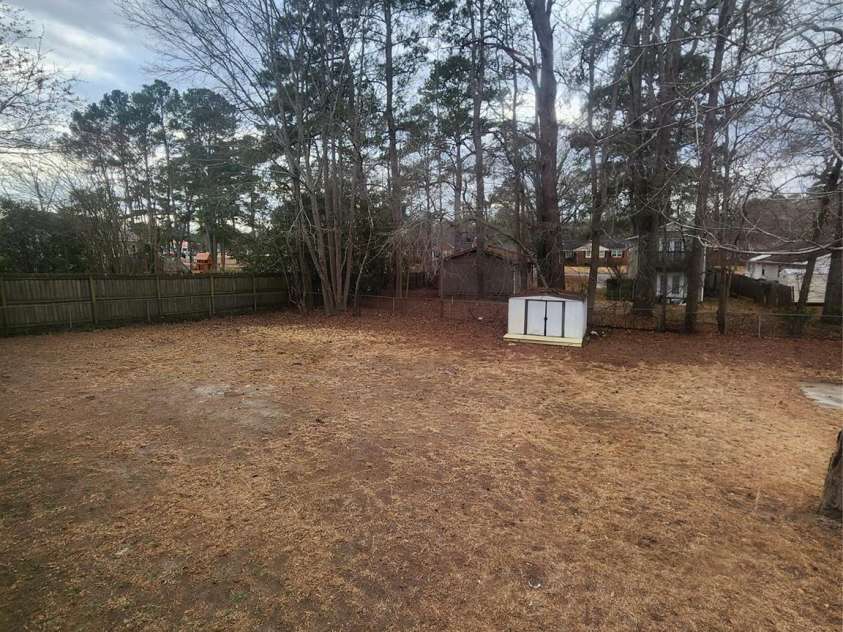 305 Louise Avenue, Rockingham, NC 28379.  MLS# CAR4231078, YatesRealty ID 8625. Back yard