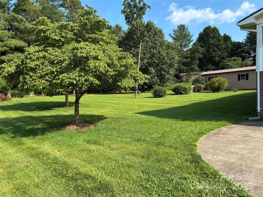 107 Mull Lane, Morganton, NC 28655.  MLS# CAR4225575, YatesRealty ID 8631. Backyard and large outbuilding