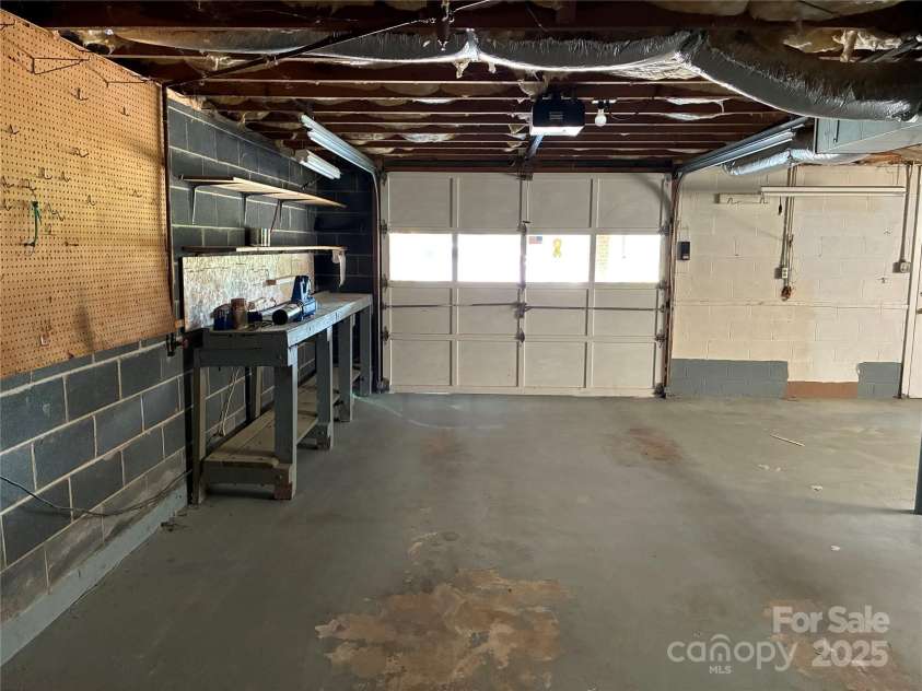 107 Mull Lane, Morganton, NC 28655.  MLS# CAR4225575, YatesRealty ID 8631. Basement garage door