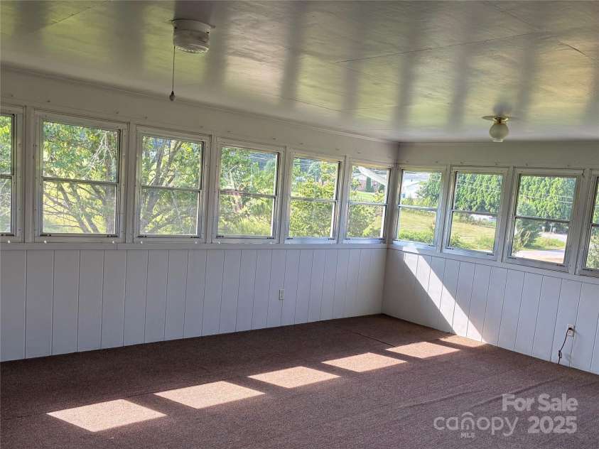 107 Mull Lane, Morganton, NC 28655.  MLS# CAR4225575, YatesRealty ID 8631. Large enclosed sunroom