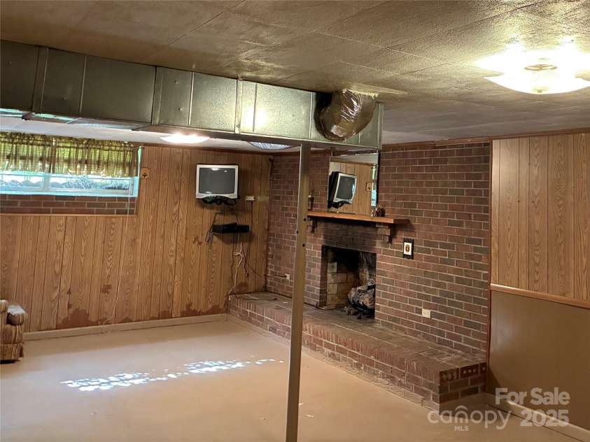 107 Mull Lane, Morganton, NC 28655.  MLS# CAR4225575, YatesRealty ID 8631. Left side of basement bonus room