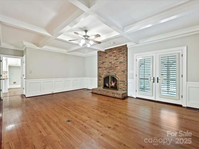 1413 Willow Oaks Trail, Weddington, NC 28104.  MLS# CAR4244521, YatesRealty ID 8632. Living Room with gas log FP, French doors to covered porch