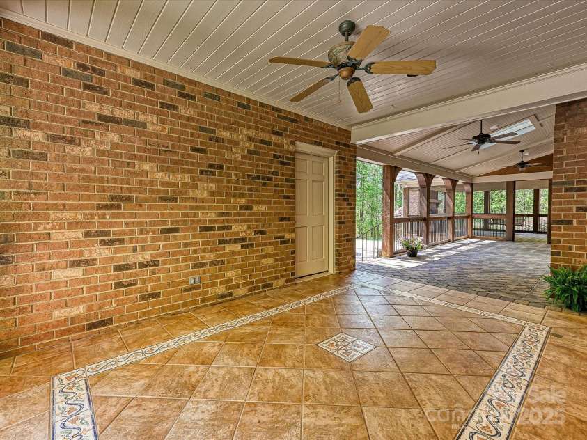 1413 Willow Oaks Trail, Weddington, NC 28104.  MLS# CAR4244521, YatesRealty ID 8632. Patio off kitchen with garage access