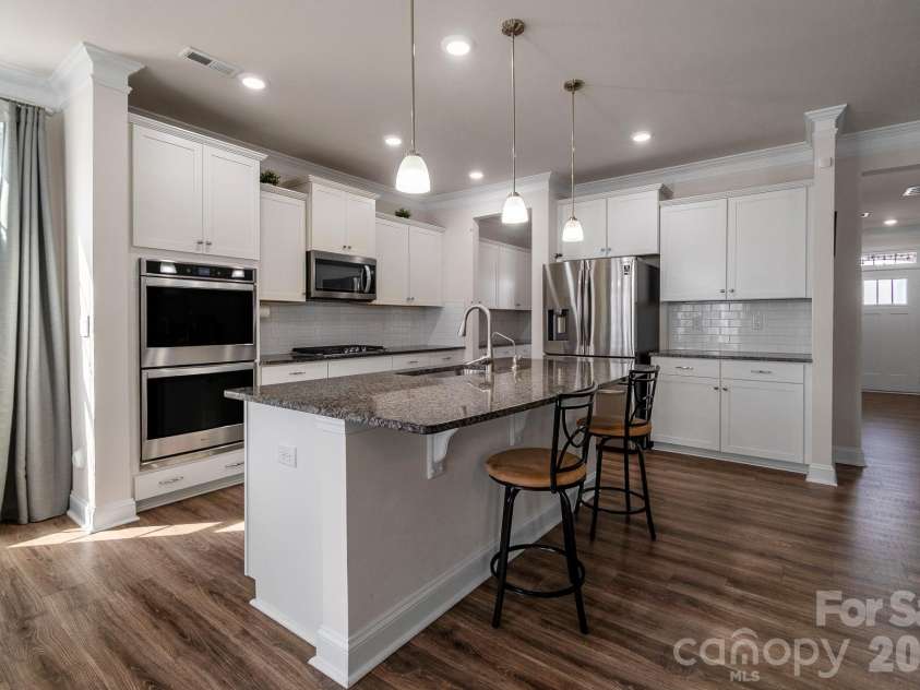 1630 Fitzgerald Street, Concord, NC 28027.  MLS# CAR4360091, YatesRealty ID 8646. Double ovens + modern kitchen setup — built for convenience