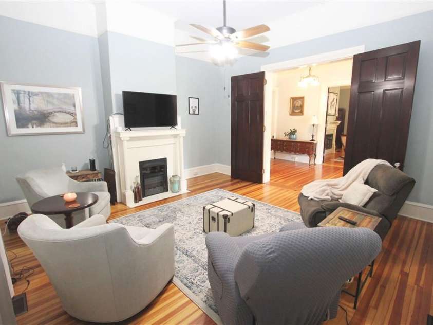 318 Camden Road, Wadesboro, NC 28170.  MLS# CAR3904497, YatesRealty ID 865. LOOK AT THOSE BEAUTIFUL DOORS, FLOORS, MANTEL,  AND COZY LOGS IN THE FIREPLACE.  WHERE'S THE REMOTE?