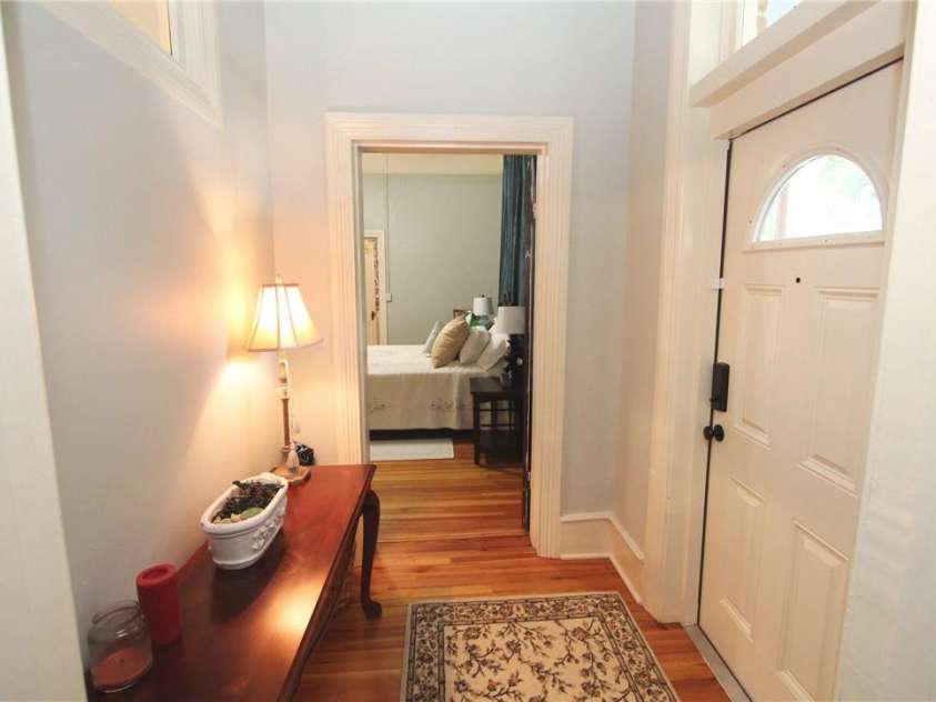 318 Camden Road, Wadesboro, NC 28170.  MLS# CAR3904497, YatesRealty ID 865. THIS IS THE SIDE PORCH ENTRY BEDROOM STRAIGHT AHEAD OR YOU CAN GO THROUGH THIS HALL TO THE LIVING ROOM.