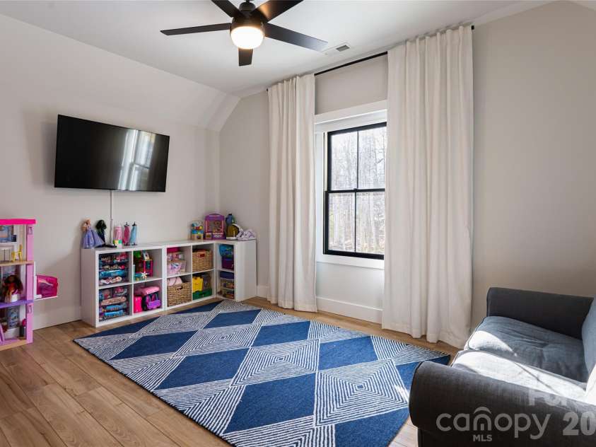 13 Cambridge Drive, Candler, NC 28715.  MLS# CAR4343251, YatesRealty ID 8656. Generously Sized Upper Bedroom with Clean lines