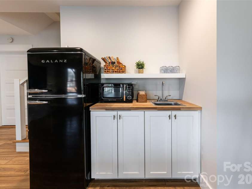 13 Cambridge Drive, Candler, NC 28715.  MLS# CAR4343251, YatesRealty ID 8656. Lower Level Kitchenette for Effortless Hosting