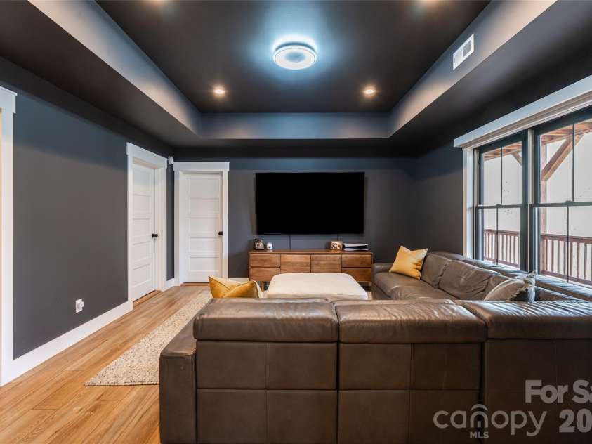 13 Cambridge Drive, Candler, NC 28715.  MLS# CAR4343251, YatesRealty ID 8656. Media Lounge for Flex Space with Walk-out Access