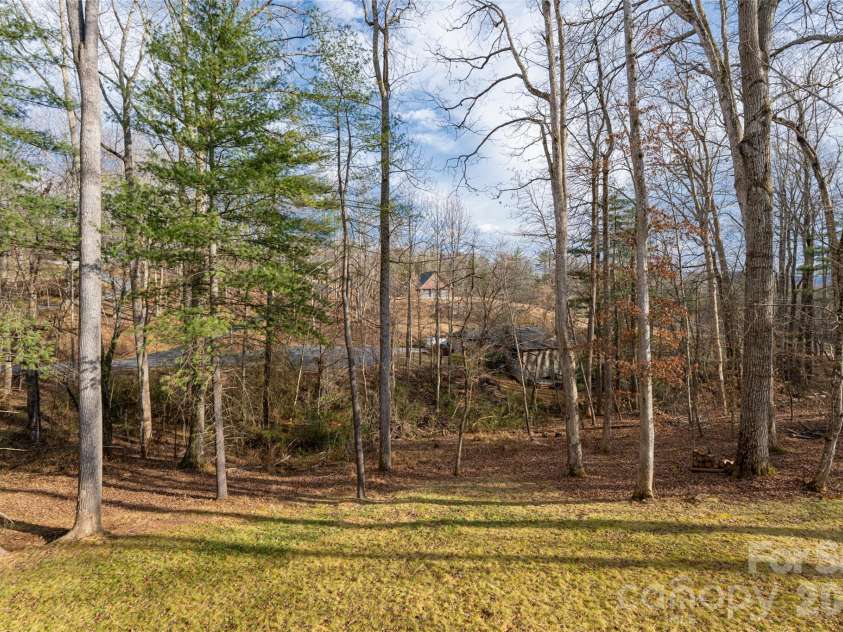 13 Cambridge Drive, Candler, NC 28715.  MLS# CAR4343251, YatesRealty ID 8656. Private Yard Surrounded by Mature Trees
