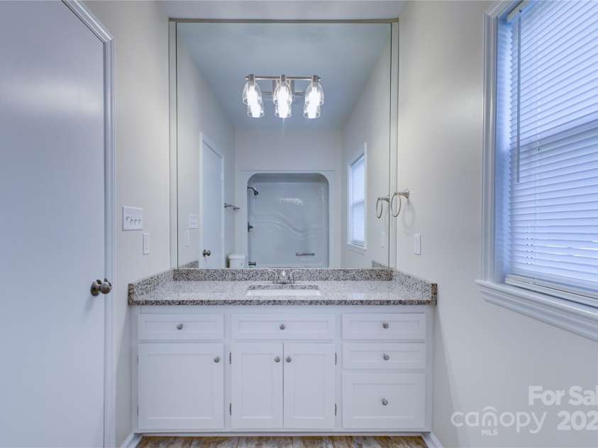 5909 Maple Street, Charlotte, NC 28269.  MLS# CAR4314238, YatesRealty ID 8661. Main Bathroom Sink Vanity
