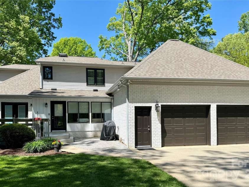 105 Beach Lane, Mooresville, NC 28117.  MLS# CAR4240933, YatesRealty ID 8681. Back of home with 2 car garage and back deck