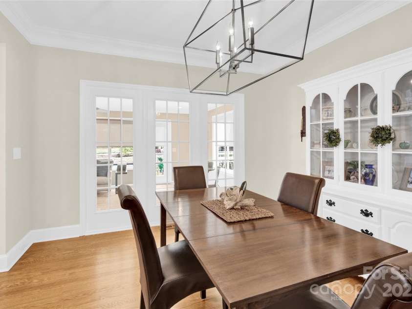 105 Beach Lane, Mooresville, NC 28117.  MLS# CAR4240933, YatesRealty ID 8681. Dining room looking into the sunroom