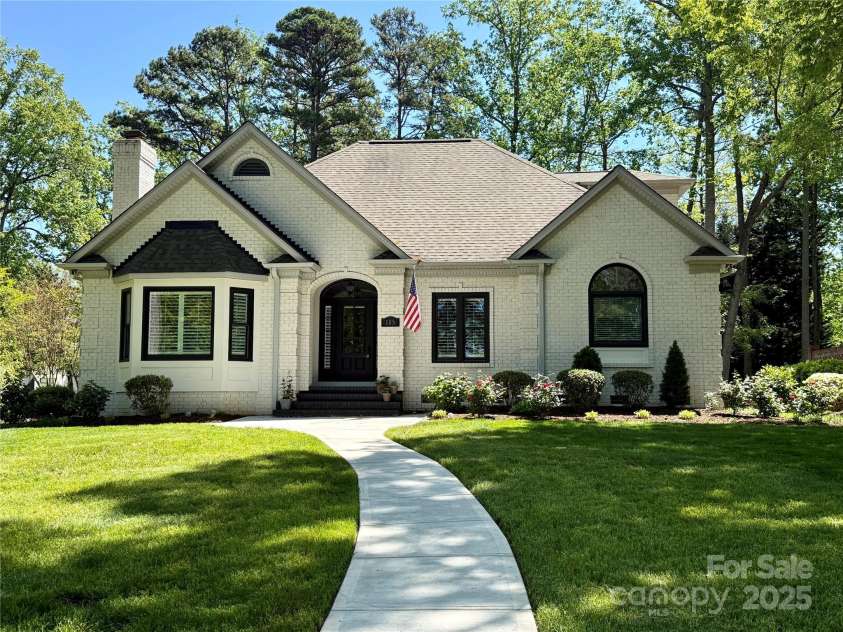 105 Beach Lane, Mooresville, NC 28117.  MLS# CAR4240933, YatesRealty ID 8681. Front of home - water view from front yard