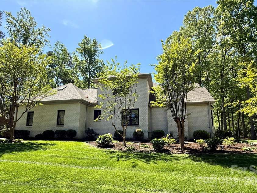 105 Beach Lane, Mooresville, NC 28117.  MLS# CAR4240933, YatesRealty ID 8681. Side yard
