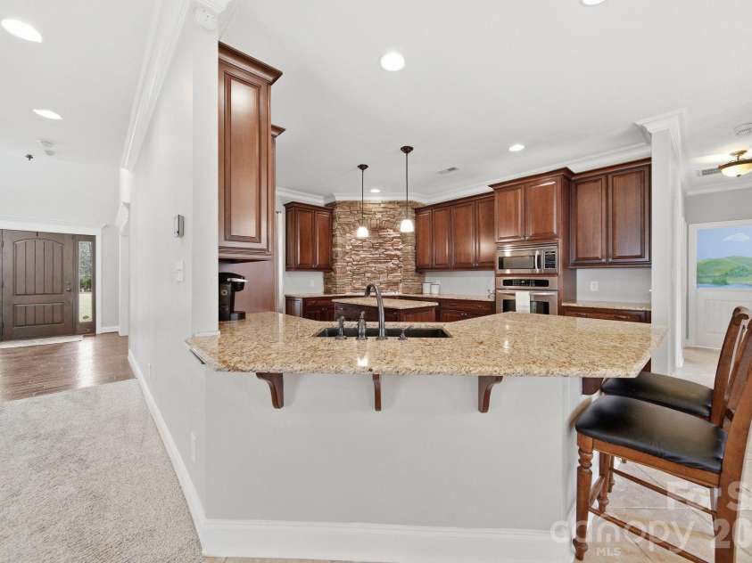 433 Laurel Crest Drive, Kannapolis, NC 28081.  MLS# CAR4345135, YatesRealty ID 8682. Bar area is great for entertaining