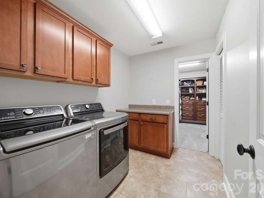 433 Laurel Crest Drive, Kannapolis, NC 28081.  MLS# CAR4345135, YatesRealty ID 8682. Laundry off of primary closet