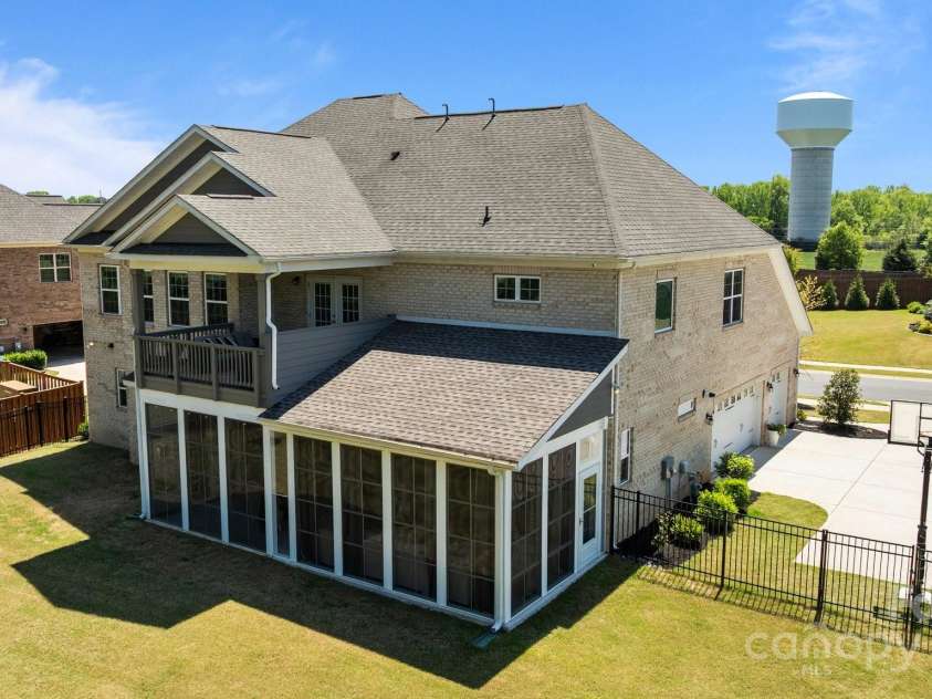 1052 Harlow's Crossing Drive, Weddington, NC 28104.  MLS# CAR4246716, YatesRealty ID 8684. Drone back exterior