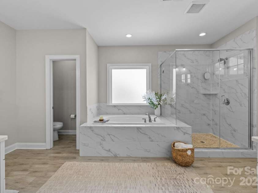 1052 Harlow's Crossing Drive, Weddington, NC 28104.  MLS# CAR4246716, YatesRealty ID 8684. Master tub & shower