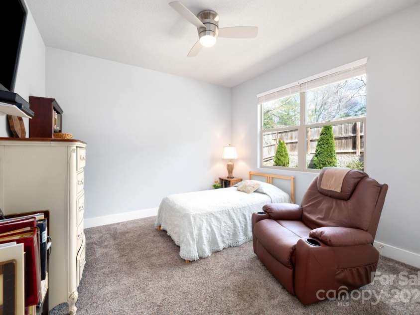 19 Dynasty Lane, Candler, NC 28715.  MLS# CAR4243539, YatesRealty ID 8687. Bedroom Overlooks Back Yard