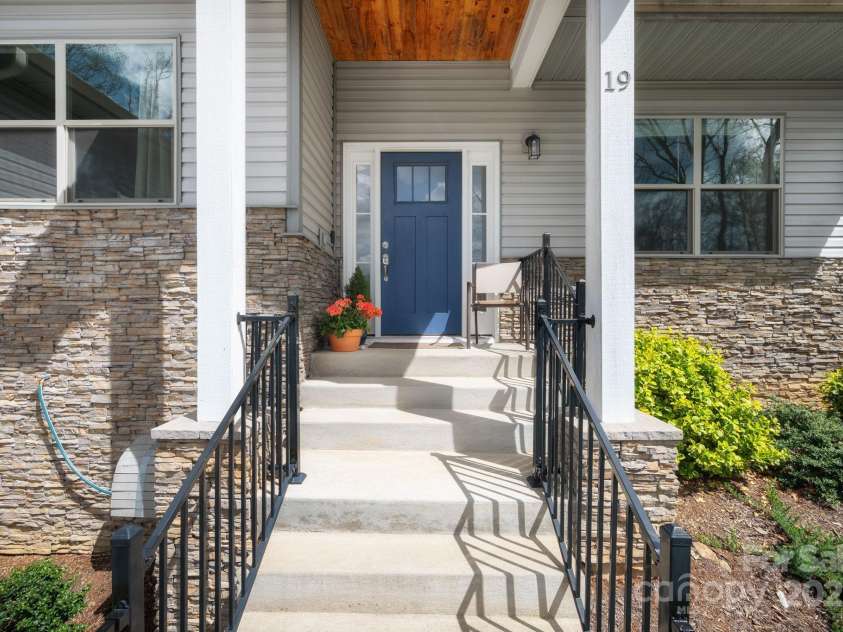 19 Dynasty Lane, Candler, NC 28715.  MLS# CAR4243539, YatesRealty ID 8687. Covered Front Porch with Long-Range Mountain Views