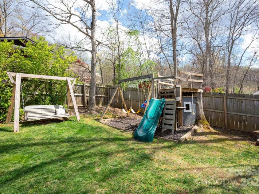 19 Dynasty Lane, Candler, NC 28715.  MLS# CAR4243539, YatesRealty ID 8687. Playground and Swinging Bench for Leisure Time