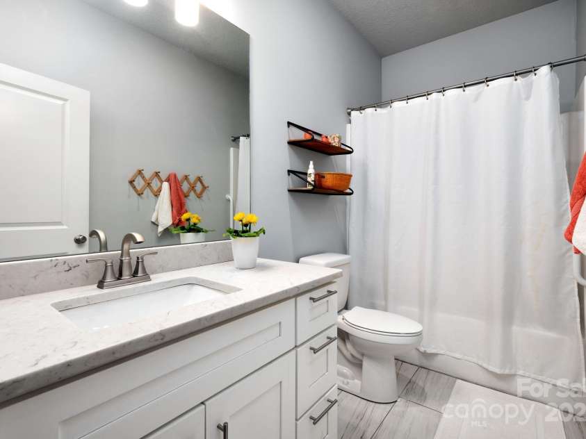 19 Dynasty Lane, Candler, NC 28715.  MLS# CAR4243539, YatesRealty ID 8687. Second Full Bath