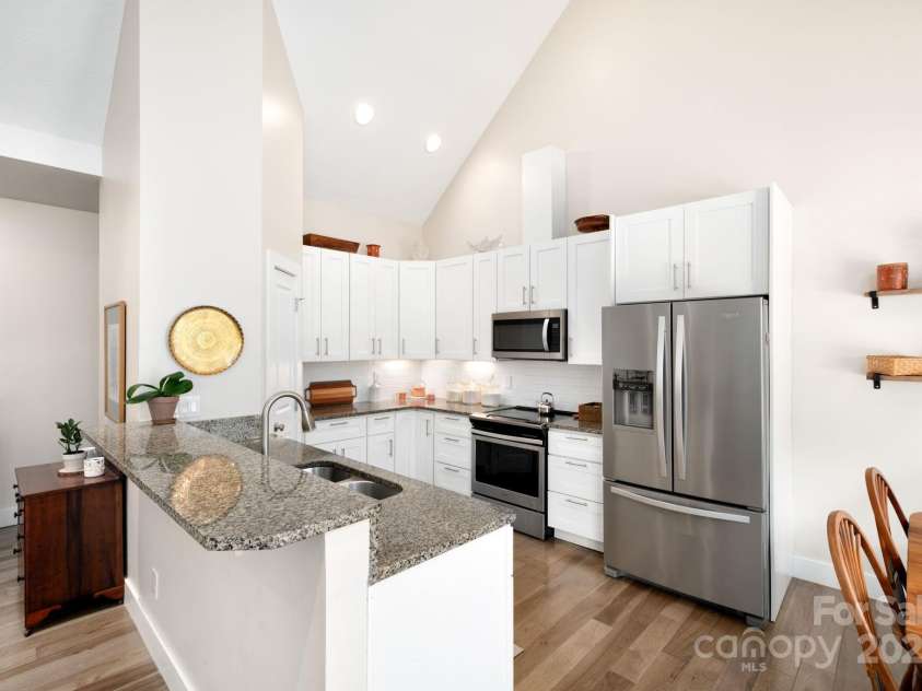 19 Dynasty Lane, Candler, NC 28715.  MLS# CAR4243539, YatesRealty ID 8687. Sparkling Kitchen Features Granite and Stainless Steel