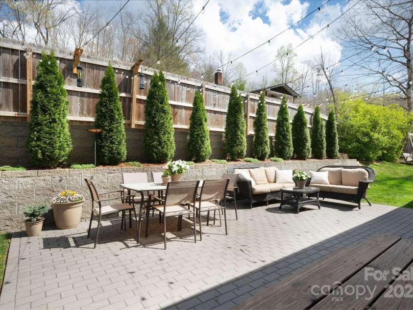 19 Dynasty Lane, Candler, NC 28715.  MLS# CAR4243539, YatesRealty ID 8687. Sunny Patio for Gatherings