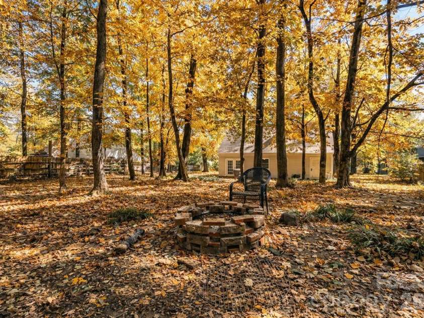 2113 Killarney Place, Charlotte, NC 28262.  MLS# CAR4247042, YatesRealty ID 8697. Large, private wooded back yard