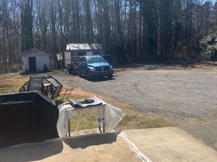 920 Oakridge Farm Highway, Mooresville, NC 28115.  MLS# CAR4228982, YatesRealty ID 8698. Plenty of parking with widened driveway and 2 wired storage sheds