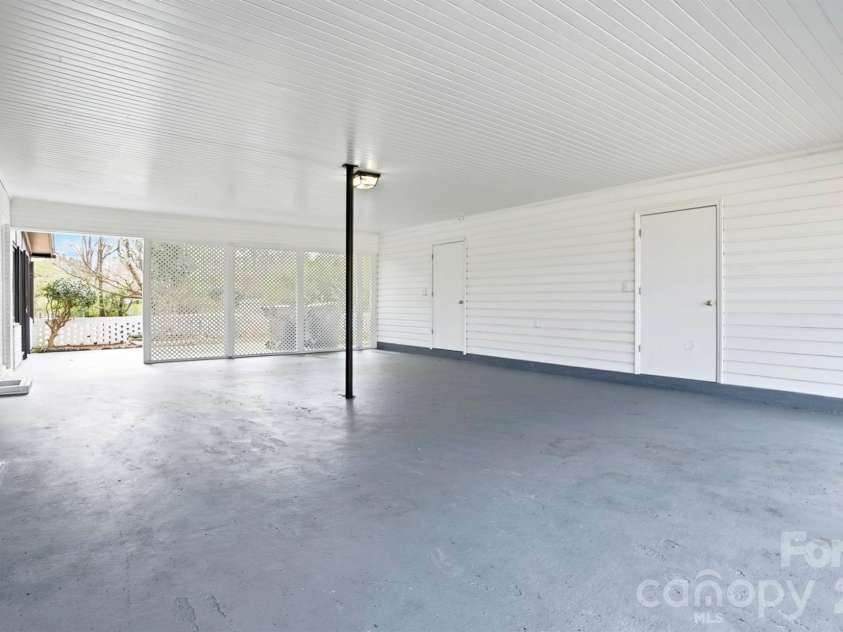 125 Forest Hills Drive, Monroe, NC 28112.  MLS# CAR4355616, YatesRealty ID 8704. Carport with Storage Room