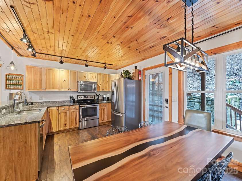 61 Calm Creek Road, Waynesville, NC 28785.  MLS# CAR4213284, YatesRealty ID 8705. Dining off kitchen