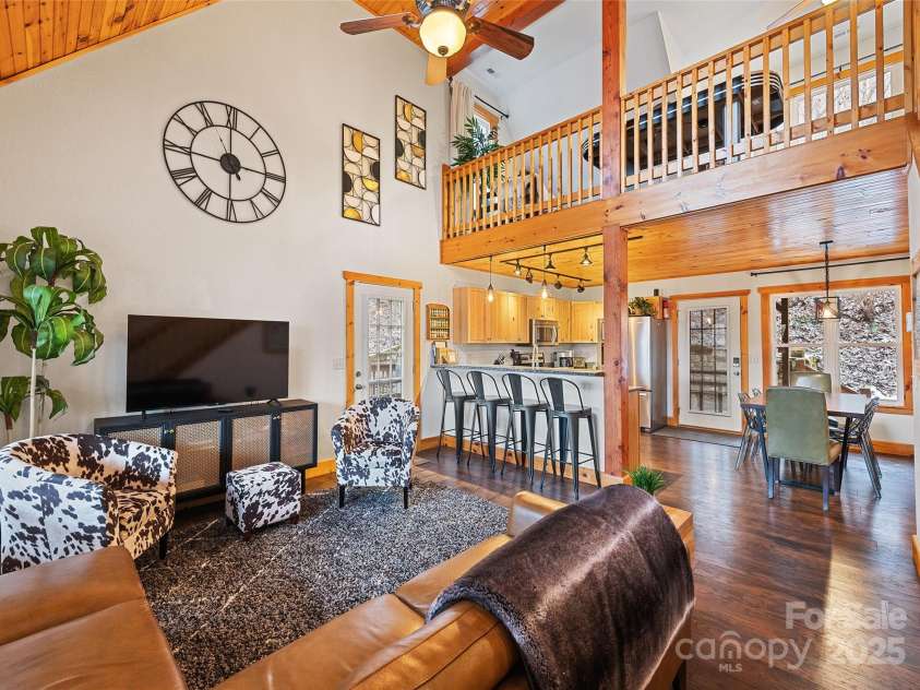 61 Calm Creek Road, Waynesville, NC 28785.  MLS# CAR4213284, YatesRealty ID 8705. Living room w/cathedral ceiling